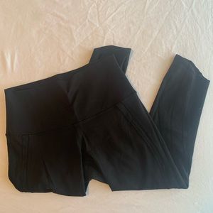 Cropped Lululemon leggings. Cutouts along legs.